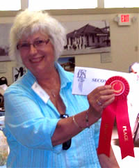 Carole accepting award